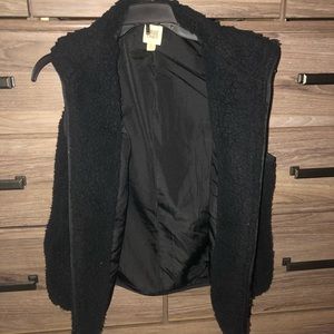 Juniors size large Sherpa material vest.